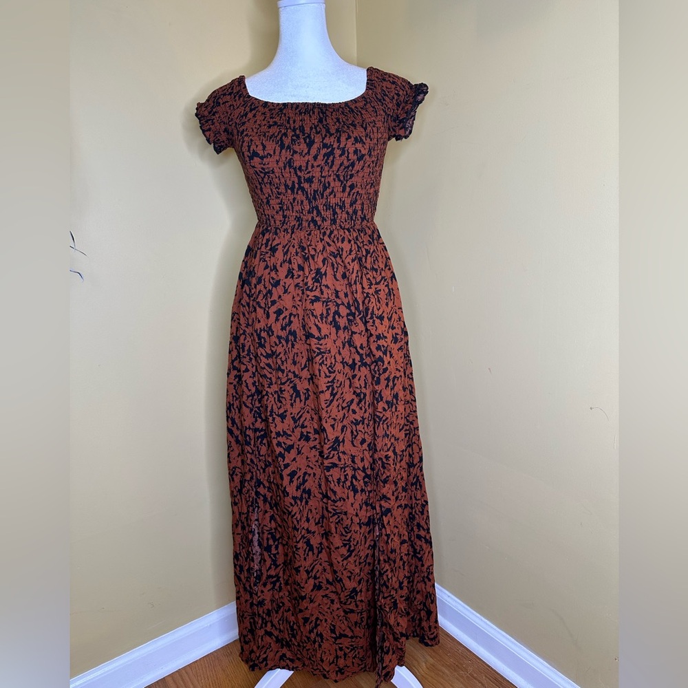 COPY - Rust dress with black pattern and off shoulder sleeves.